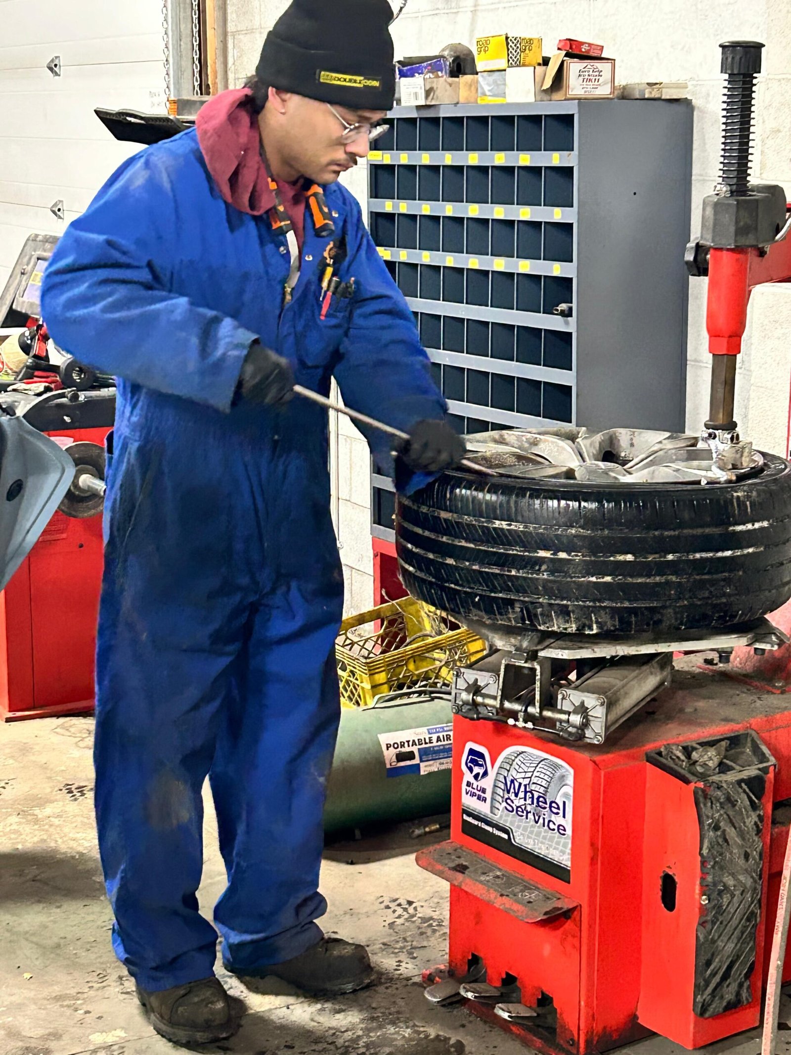 Tire Repair Edmonton – C&S Auto Repair Mechanic performing tire repair in Edmonton with tire changing machine